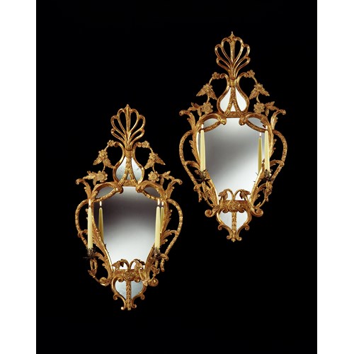 A PAIR OF GEORGE III CARVED GILTWOOD GIRANDOLES